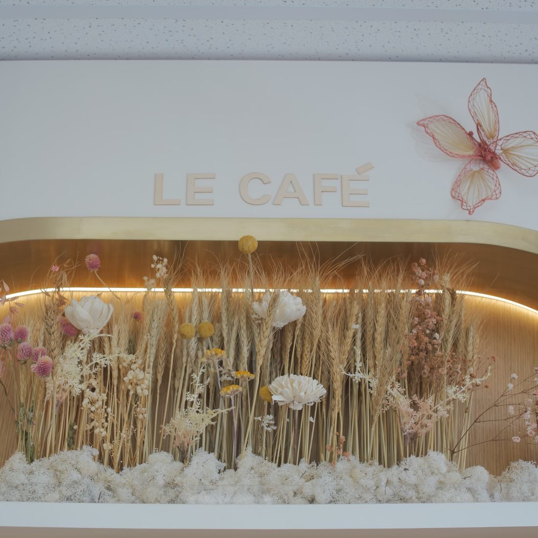 A complimentary drink served in the modern interior of The New Era Nails